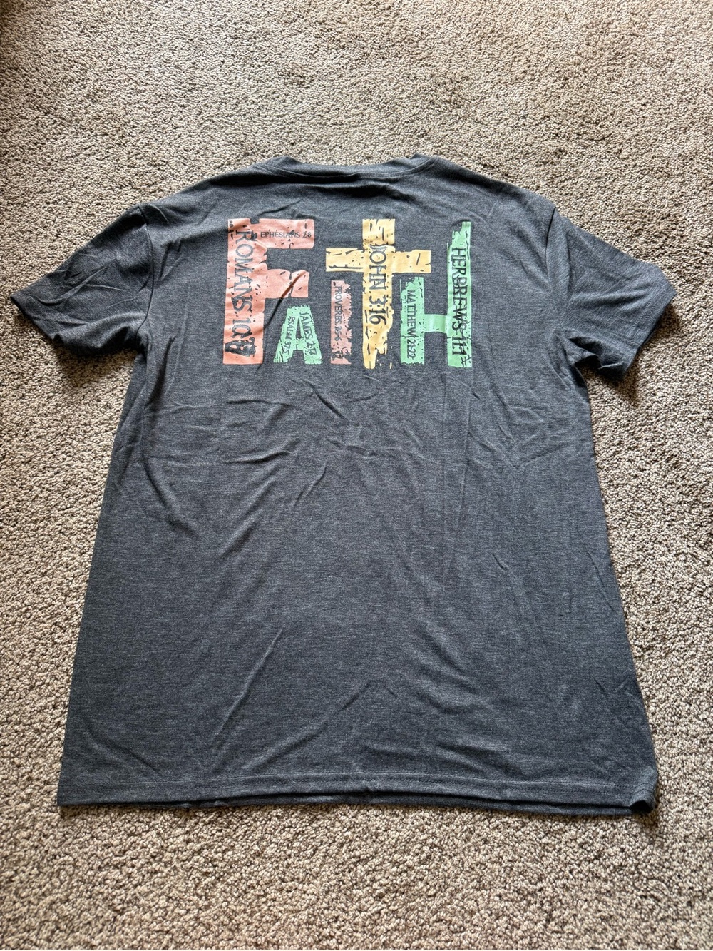 New in package. Ladies tshirt with religious graphics on back.